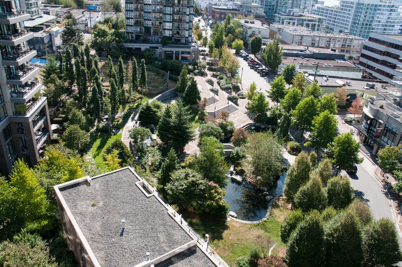 Bright living room with city view and modern furnishings. - 1102 -170 W 1st Street, North Vancouver