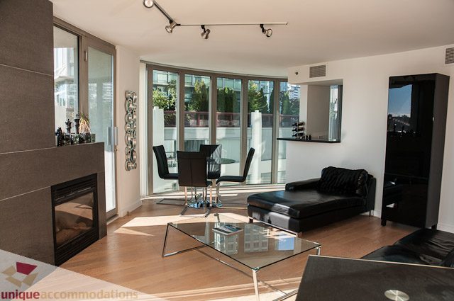 Furnished living room with hardwood floors, city view, and modern decor. - 604-1000 Beach Avenue, Vancouver Downtown