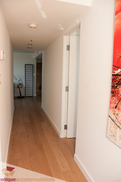 Furnished hallway with hardwood floors and modern decor. - 604-1000 Beach Avenue, Vancouver Downtown