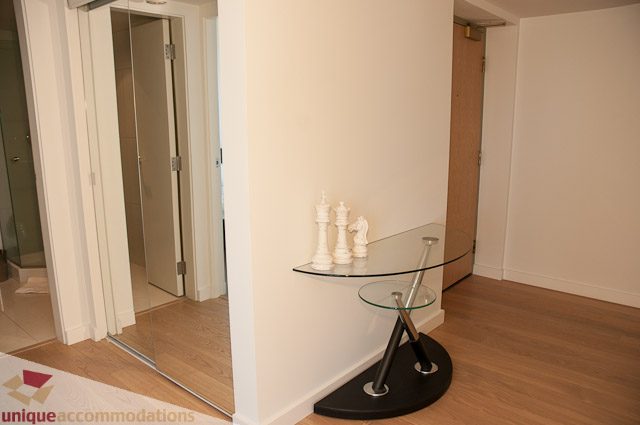 Furnished living area with glass coffee table and wooden flooring. - 604-1000 Beach Avenue, Vancouver Downtown