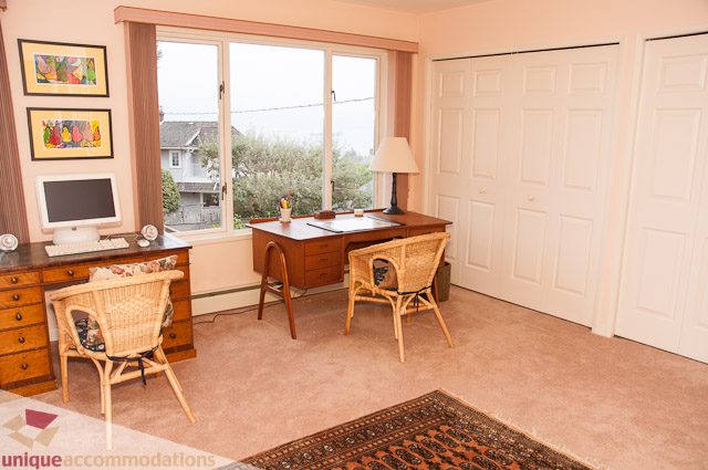 Furnished home office with desk, chair, and city view. - 4559 W. 3rd Ave, Vancouver West Side