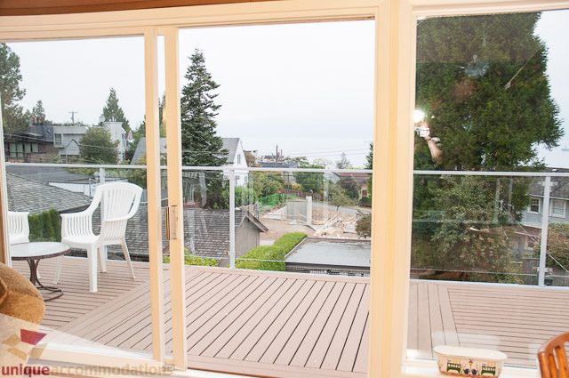 Furnished living room with hardwood floors and city view. - 4559 W. 3rd Ave, Vancouver West Side
