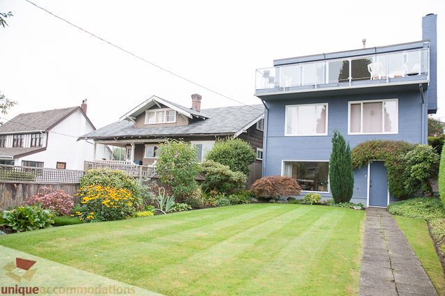 Spacious living room with modern furnishings and large windows. - 4559 W. 3rd Ave, Vancouver West Side