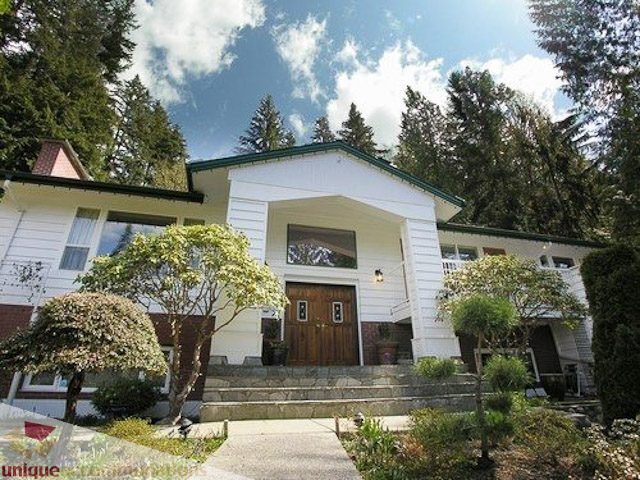 Furnished 3-bedroom suite with stone steps and lush greenery. - 1650 Riverside Drive, North Vancouver