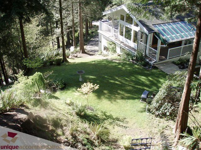 Furnished 3-bedroom suite with a spacious deck and lush greenery. - 1650 Riverside Drive, North Vancouver