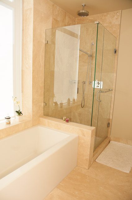 Spacious bathroom with marble countertops and a walk-in shower. - 501-150 Athletes Way, Vancouver West Side