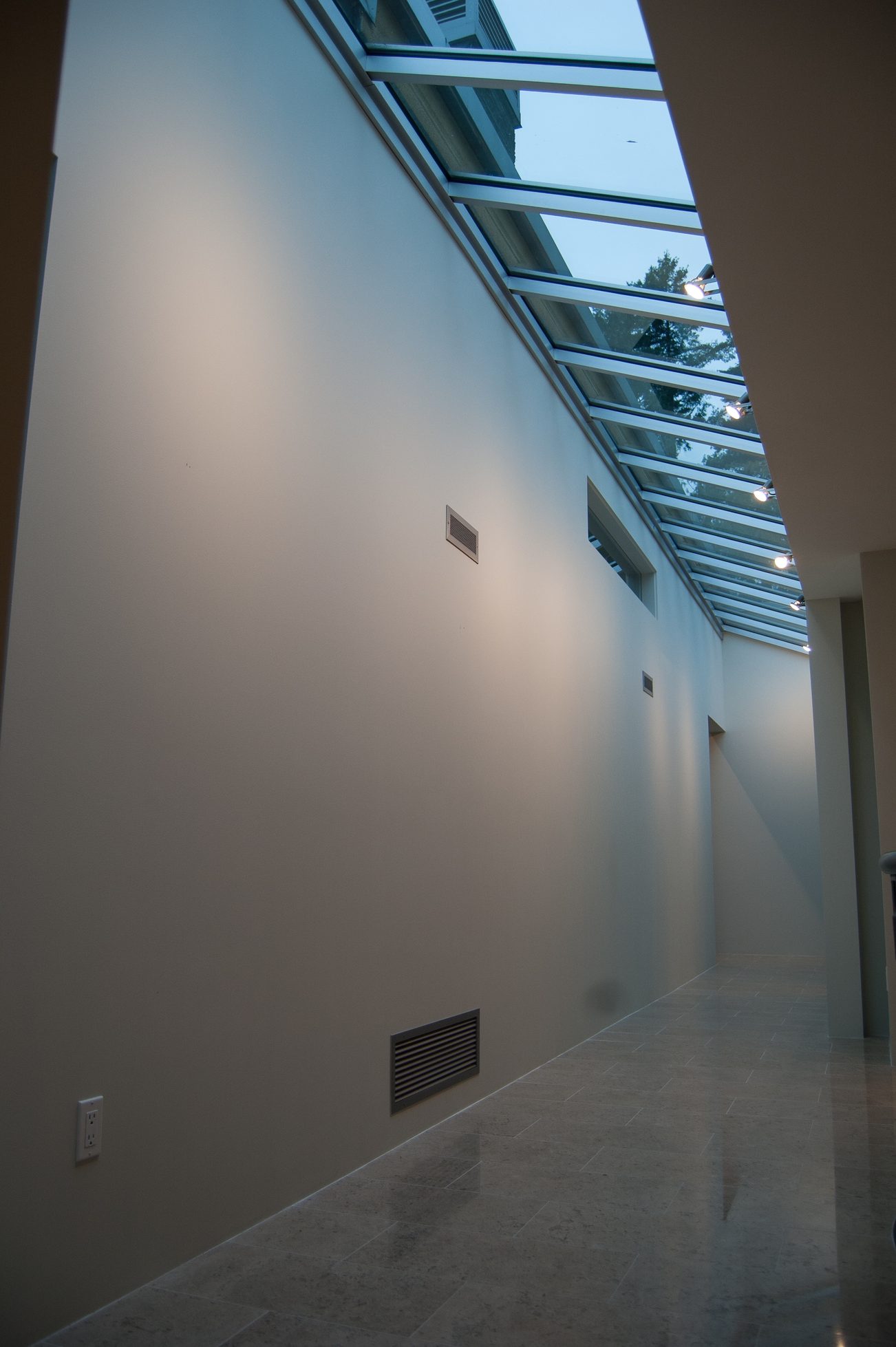 Bright hallway with skylights and tiled floors. - 4454 Regency Place, West Vancouver