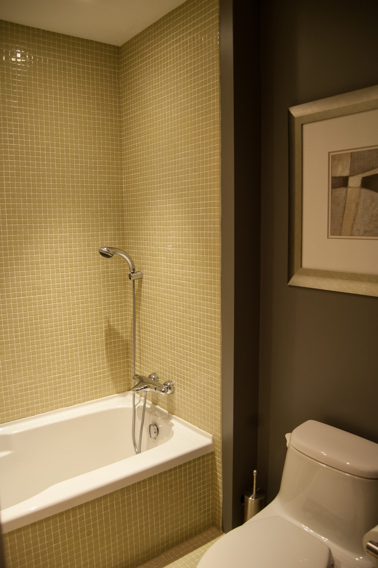 Bathroom with mosaic tiles, modern shower, and toilet. - 4454 Regency Place, West Vancouver