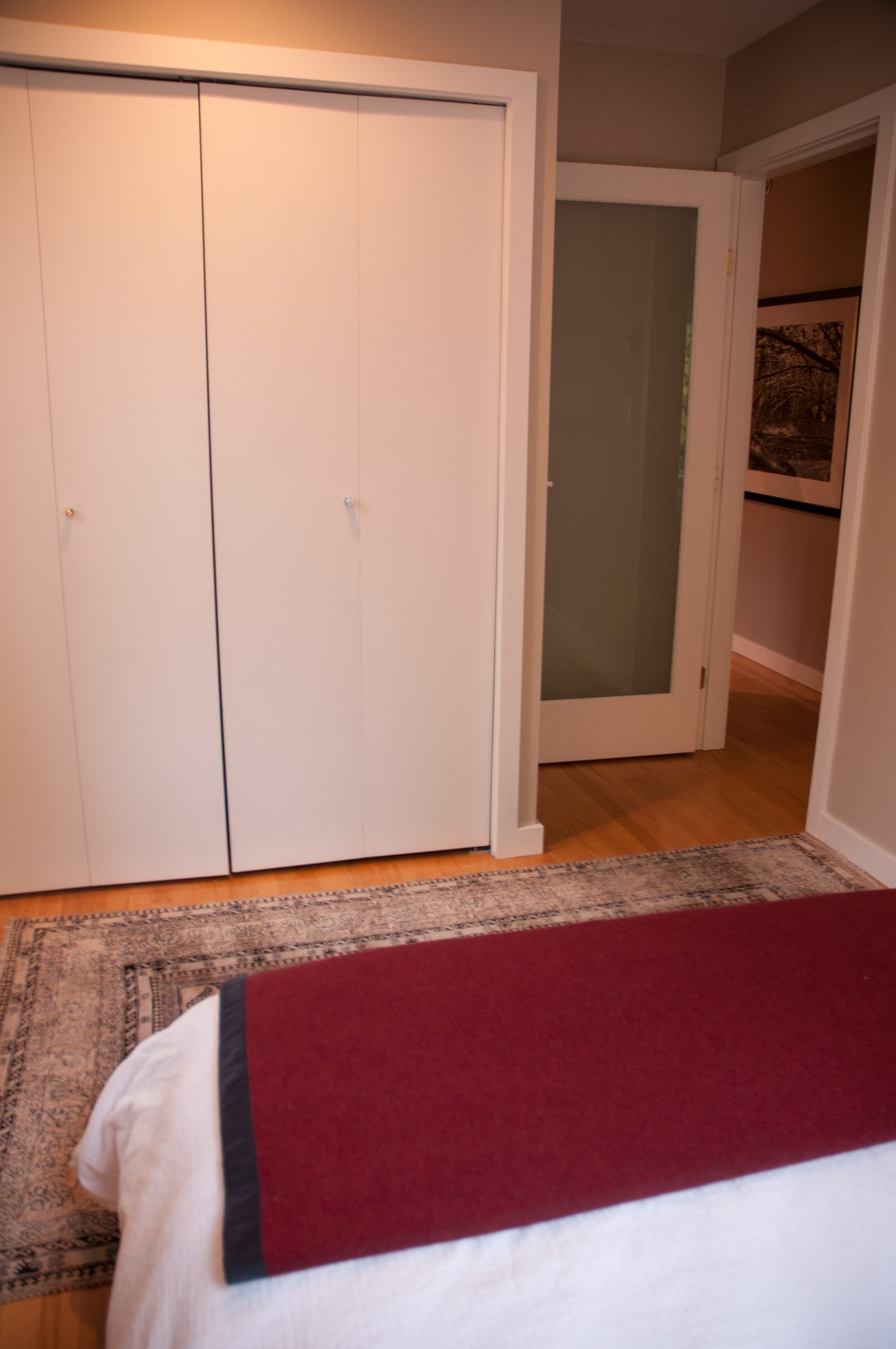 Bedroom with white closet doors and hardwood floors. - 7-2305 West 10th Ave, Vancouver West Side