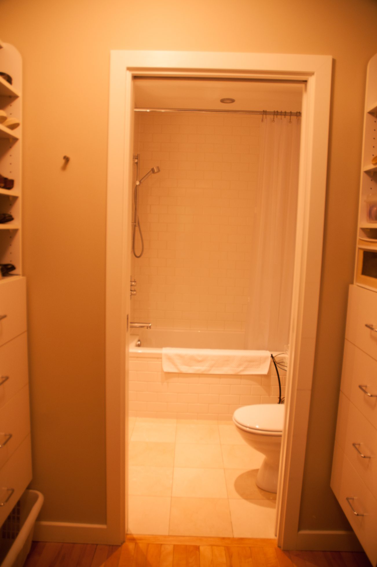 Furnished bathroom with white subway tiles, toilet, and shower. - 7-2305 West 10th Ave, Vancouver West Side