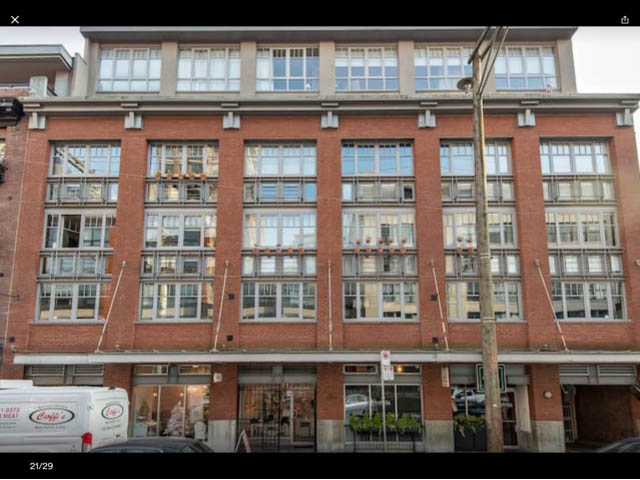 Furnished 2-bedroom condo with large windows and brick facade. - 410 - 1072 Hamilton Street, Vancouver Downtown
