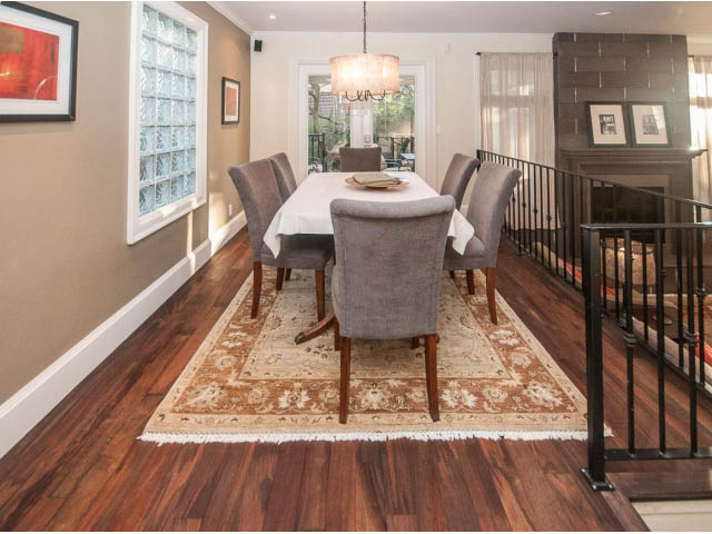 Furnished dining room with hardwood floors, large windows, and a chandelier. - 14 West 13th Ave, Vancouver East Side
