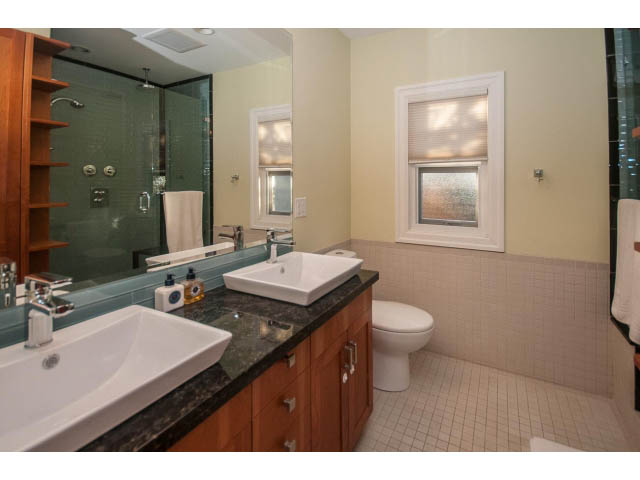 Spacious bathroom with granite countertops and modern fixtures. - 14 West 13th Ave, Vancouver East Side