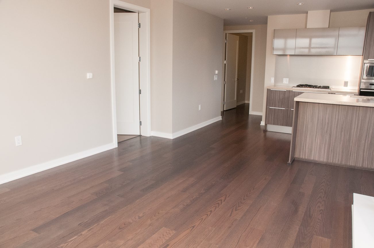 Bright kitchen with hardwood floors and a modern countertop. - 1010-181 West 1st Avenue, Vancouver West Side