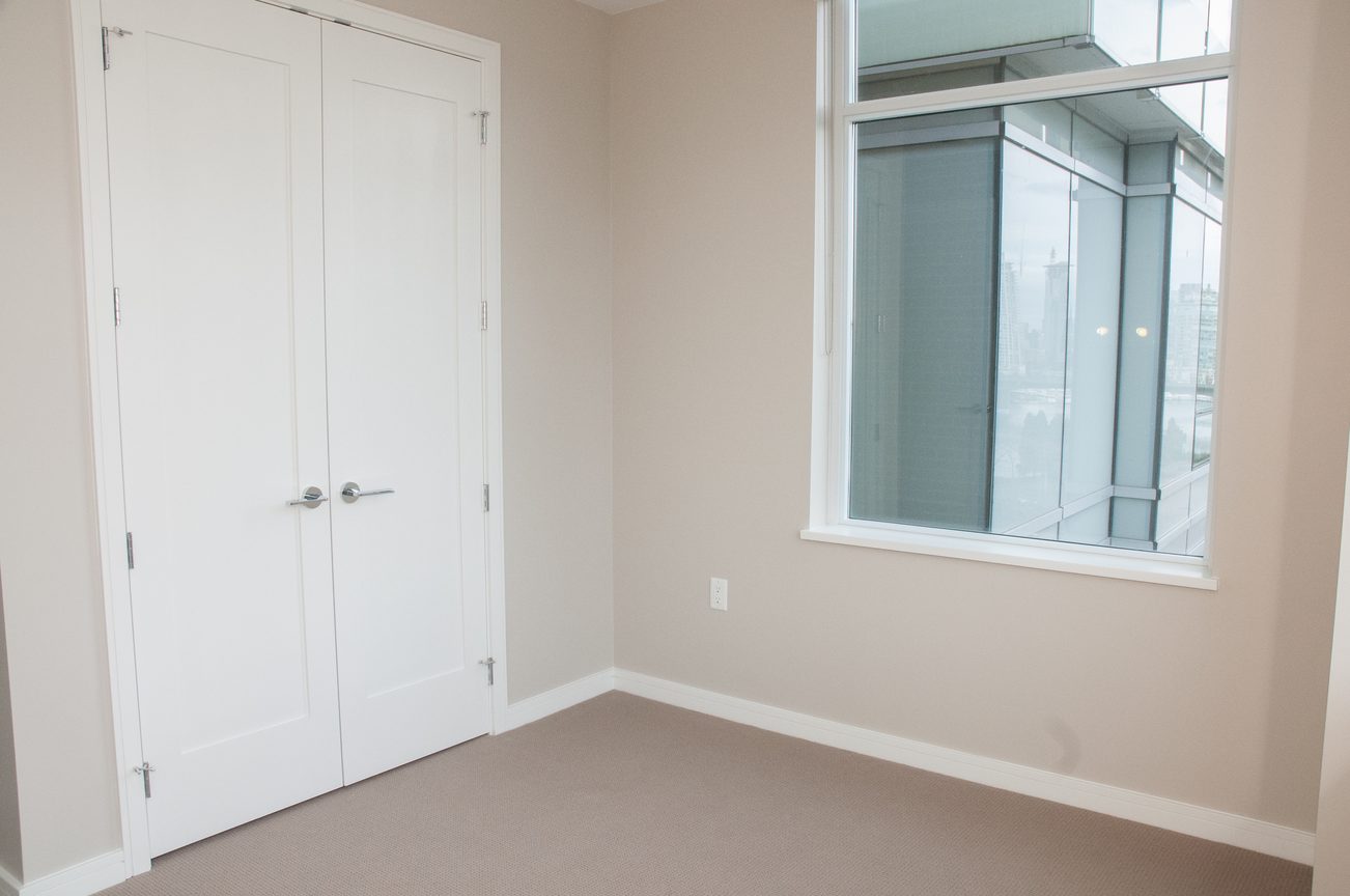 Bright den with large window offering city view, neutral walls, and carpeted floor. - 1010-181 West 1st Avenue, Vancouver West Side