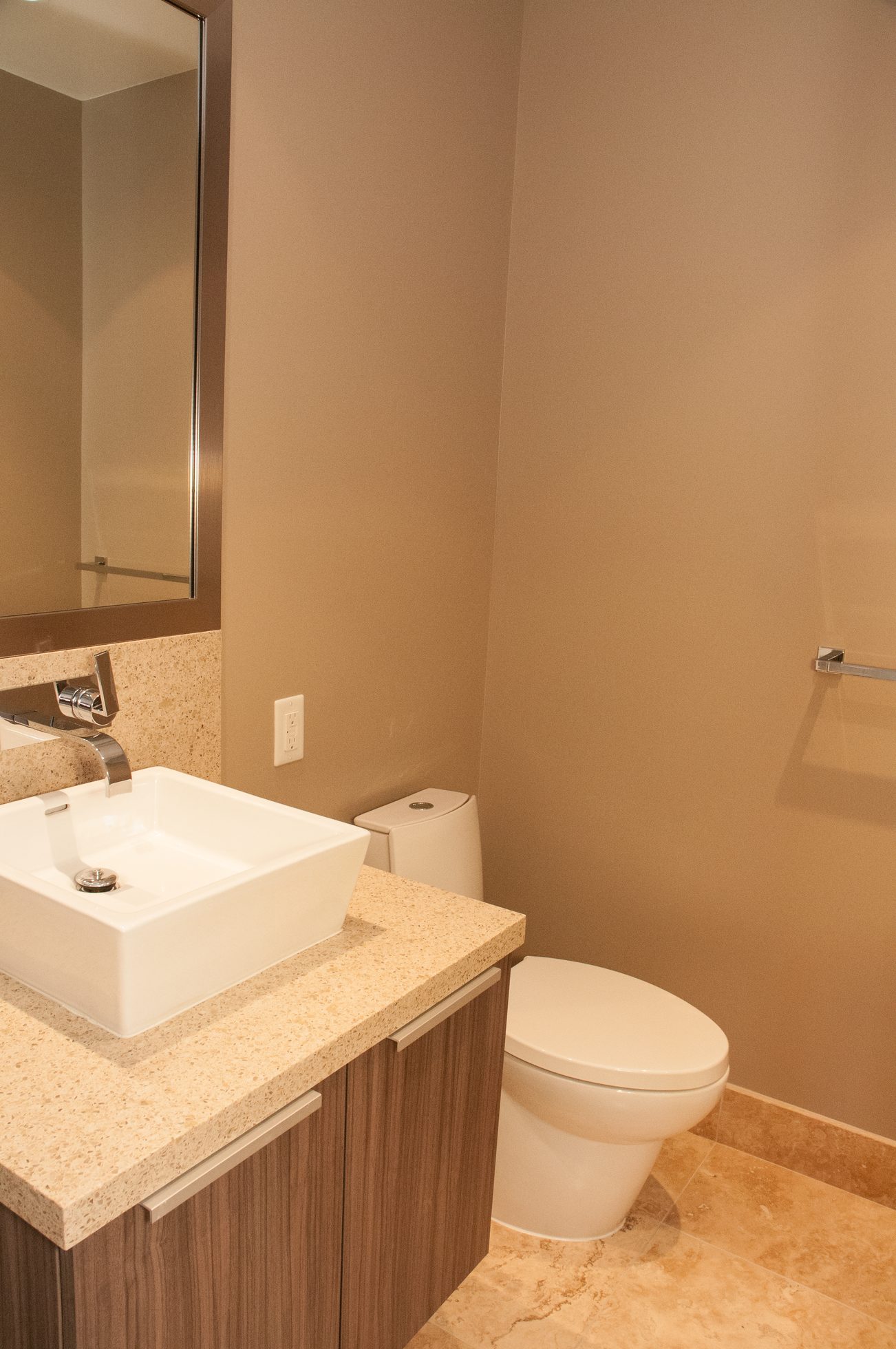 Bathroom with modern sink, granite countertop, and beige walls. - 1010-181 West 1st Avenue, Vancouver West Side