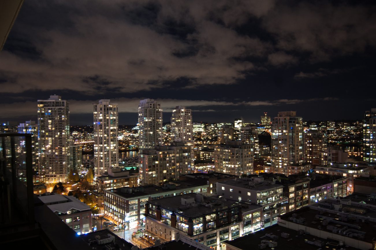 Bright living room with a stunning city view and modern furnishings. - 1901-1055 Homer Street, Vancouver Downtown