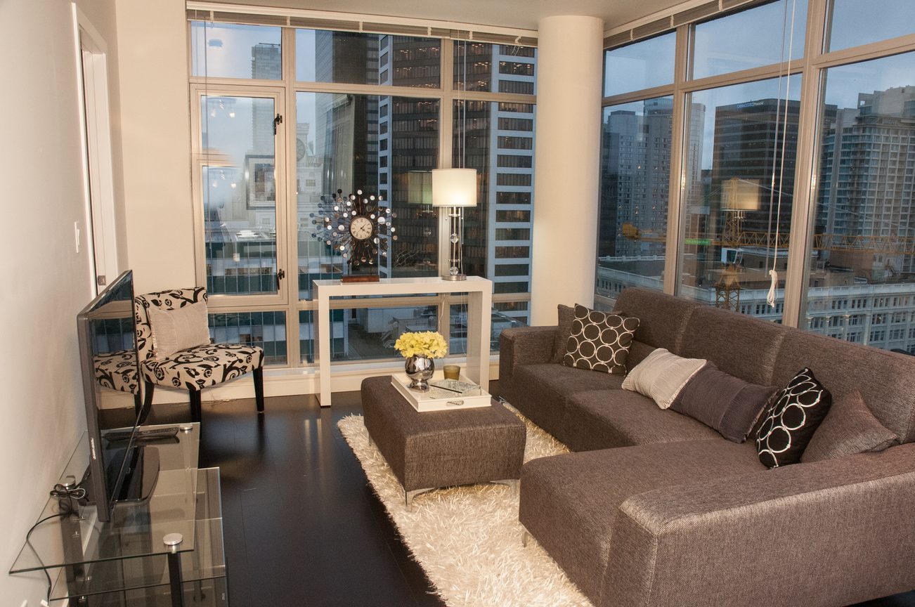 Furnished living room with city view and modern decor. - 2306-788 Richards, Vancouver Downtown