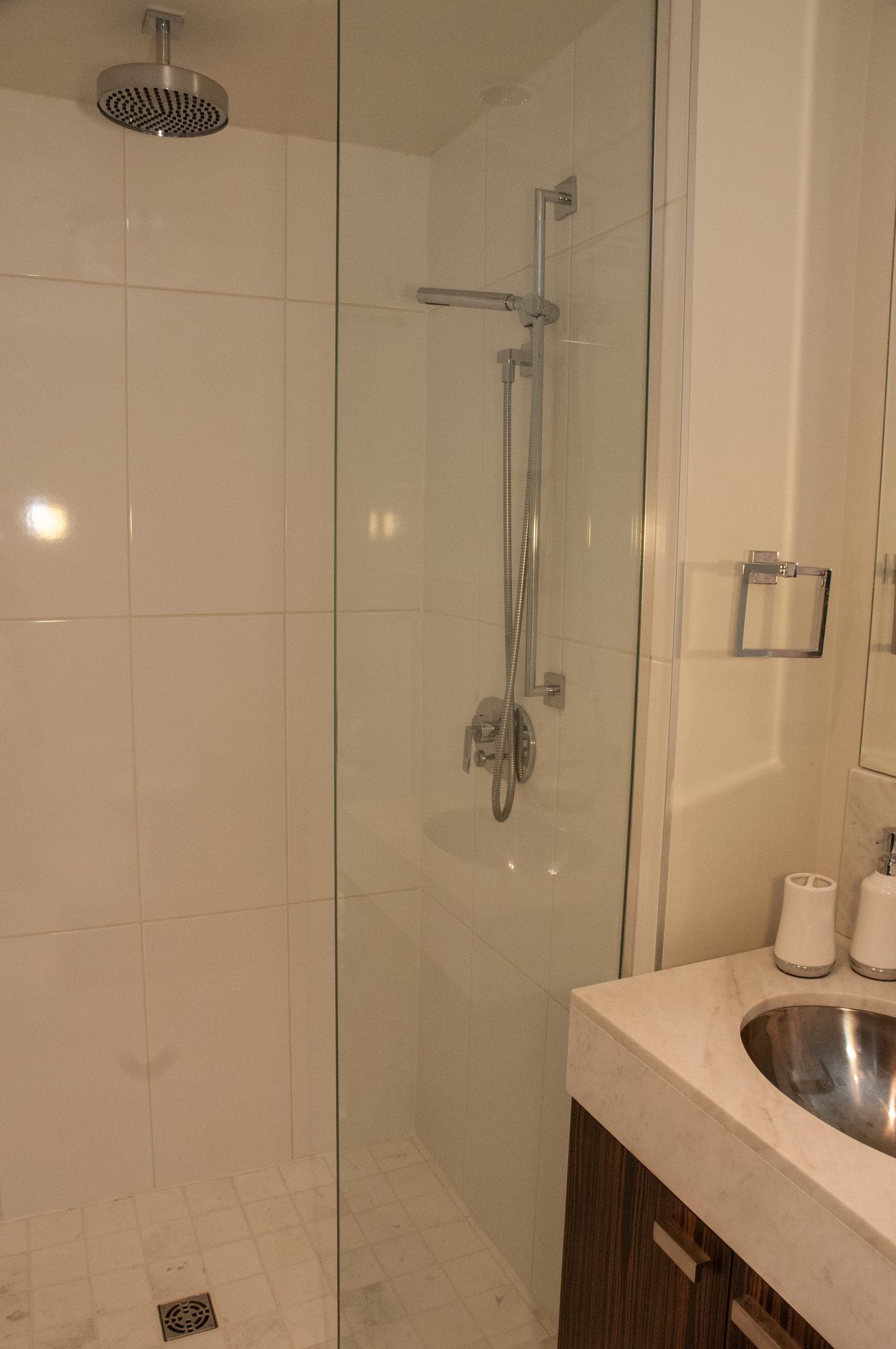 Bathroom with glass shower, marble countertop, and modern fixtures. - 2306-788 Richards, Vancouver Downtown