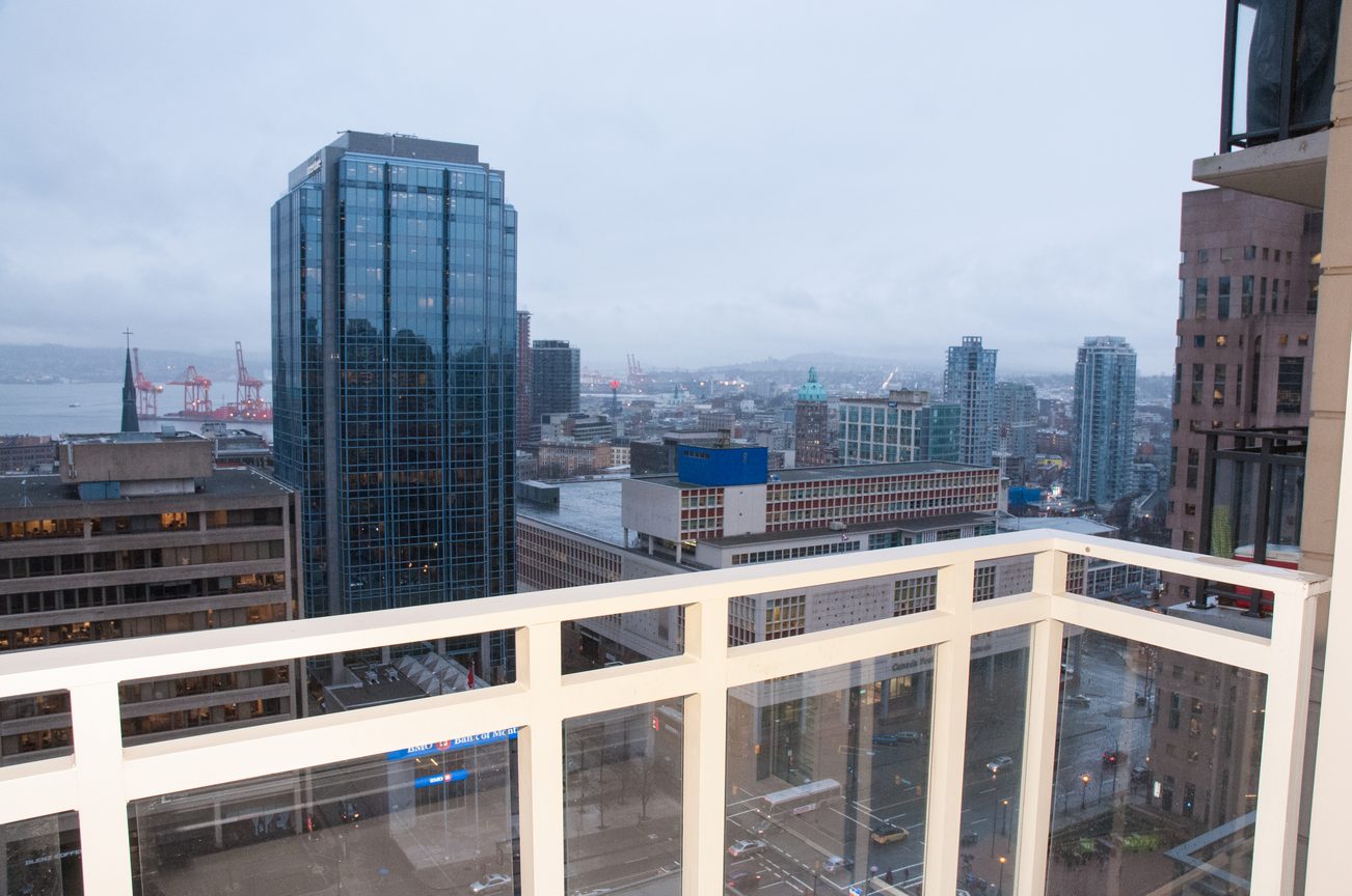 Furnished balcony with city view and modern architecture. - 2306-788 Richards, Vancouver Downtown