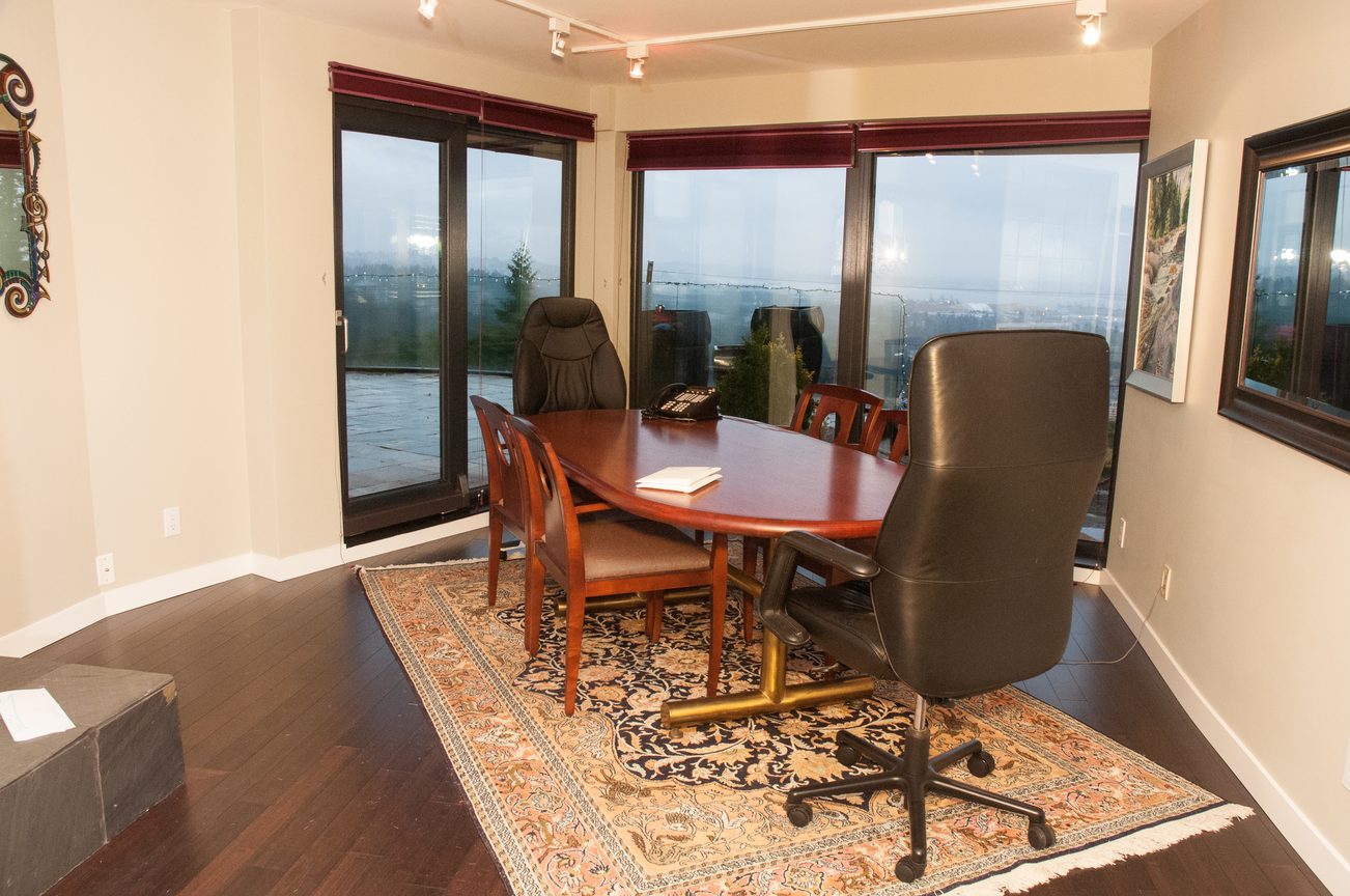 Furnished dining room with hardwood floors, large windows, and a city view. - 829 Younette Drive, West Vancouver
