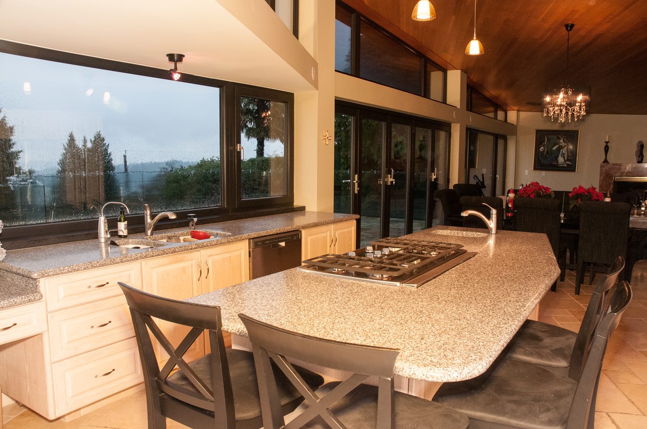 Bright kitchen with granite countertops, hardwood floors, and a city view. - 829 Younette Drive, West Vancouver