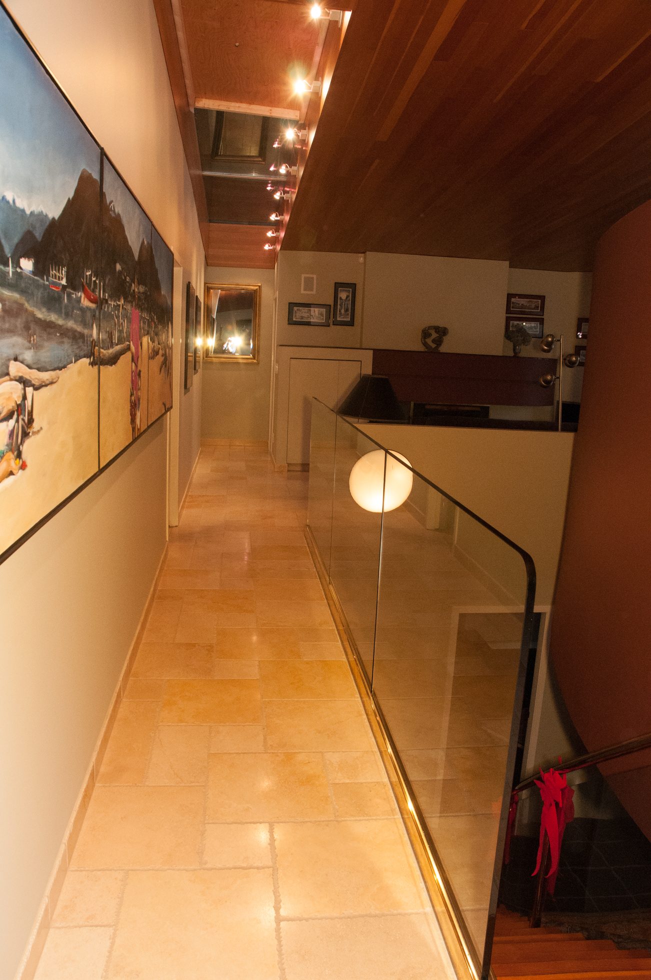 Staircase leading to upper level with glass railings and warm lighting. - 829 Younette Drive, West Vancouver