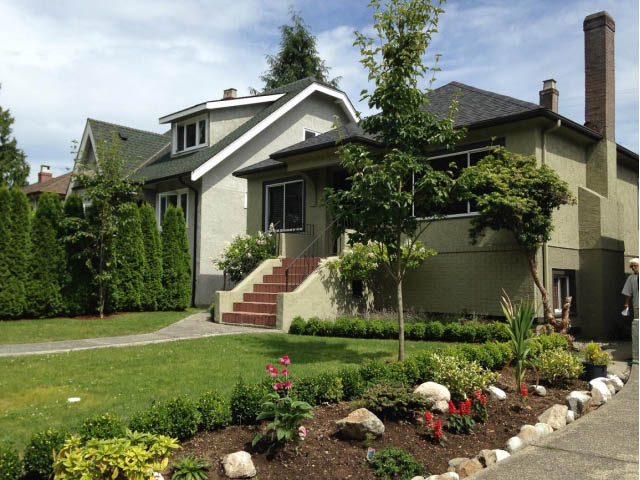 Furnished living room with cozy fireplace and large windows. - Upper - 4838 Dunbar Street, Vancouver West Side