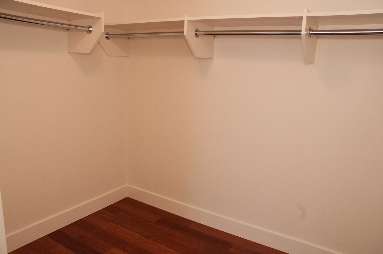 Empty closet with white shelves and hardwood floors. - 3201 - 1077 Cordova Street W, Vancouver Downtown