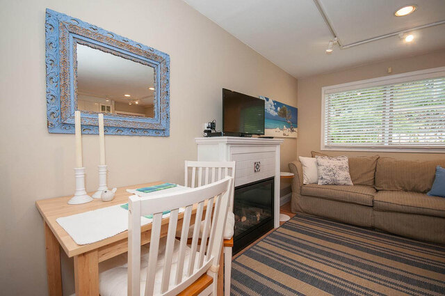 Cozy 1-bedroom house with a dining area and a fireplace, perfect for a relaxing stay. - Address WITHHELD, North Vancouver