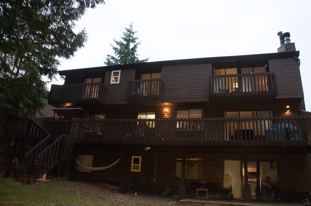 Furnished 7-bedroom house with multiple balconies and outdoor seating area. - 5550 Huckleberry Lane, North Vancouver
