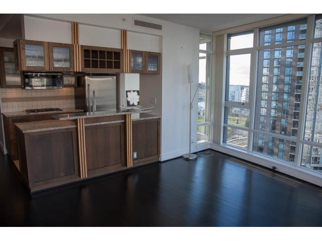 Bright kitchen with modern cabinetry, hardwood floors, and a city view. - 1501-1483 Homer Street, Vancouver Downtown