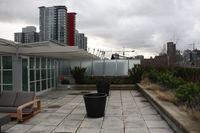 Penthouse patio with city view, modern furnishings, and potted plants. - 702- 546 Beatty Street, Vancouver Downtown