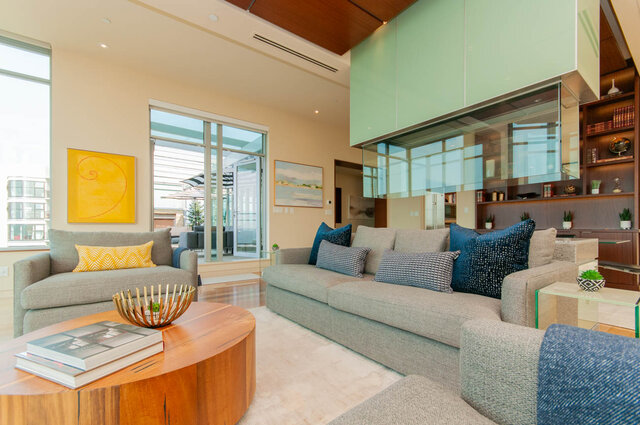 Spacious living room with modern furniture, large windows, and a glass partition. - 2901 - 1005 Beach Ave, Vancouver Downtown