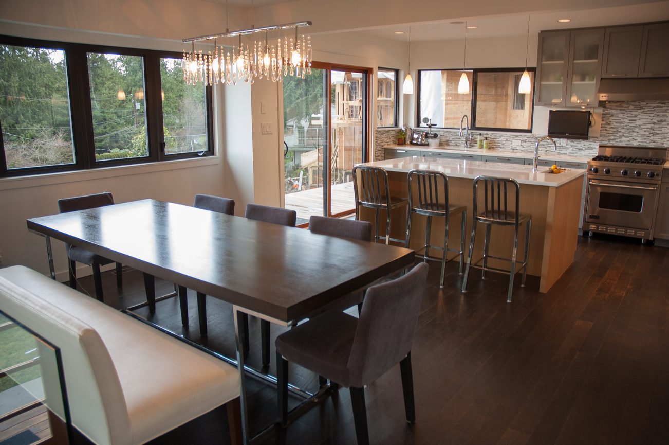 Bright kitchen with modern island, hardwood floors, and city view. - 3925 Viewridge Place, West Vancouver