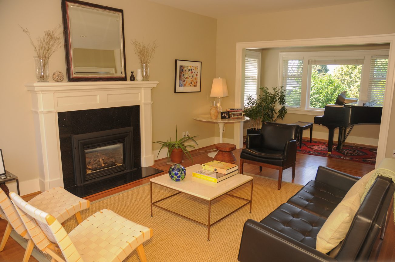 Furnished living room with fireplace, modern furniture, and piano in corner. - 2037 Quilchena Crescent, Vancouver West Side
