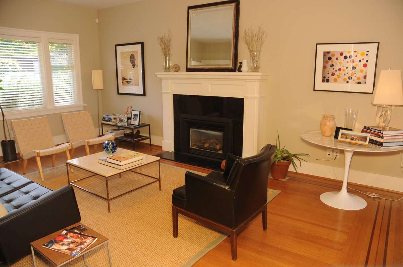 Furnished living room with hardwood floors, a fireplace, and mid-century modern furniture. - 2037 Quilchena Crescent, Vancouver West Side