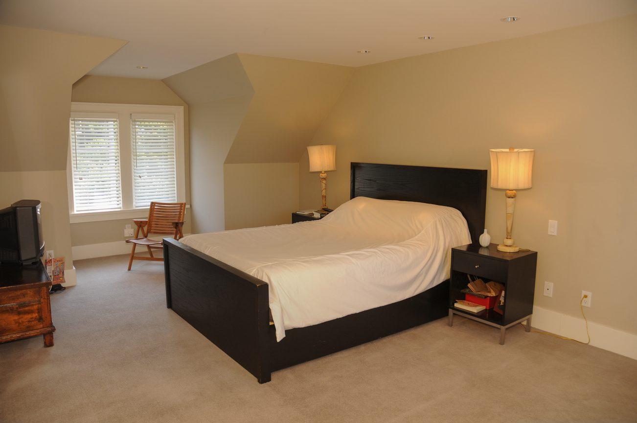 Spacious bedroom with a modern bed, two lamps, and a window with blinds. - 2037 Quilchena Crescent, Vancouver West Side