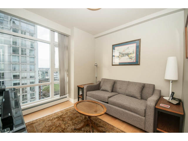 Furnished living room with city view and hardwood floors. - 2901 - 1199 Marinaside, Vancouver Downtown