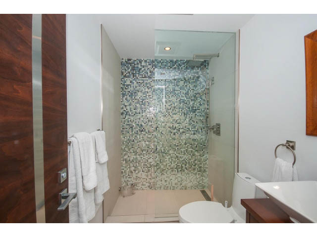 Bright bathroom with mosaic tiles and modern fixtures. - 806 - 518 Moberly Rd, Vancouver West Side
