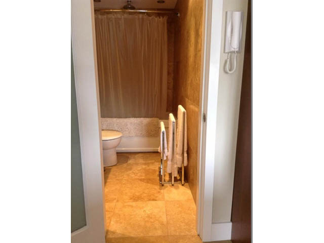 Furnished bathroom with shower curtain and towel rack. - 501 - 1251 Cardero Street, Vancouver Downtown