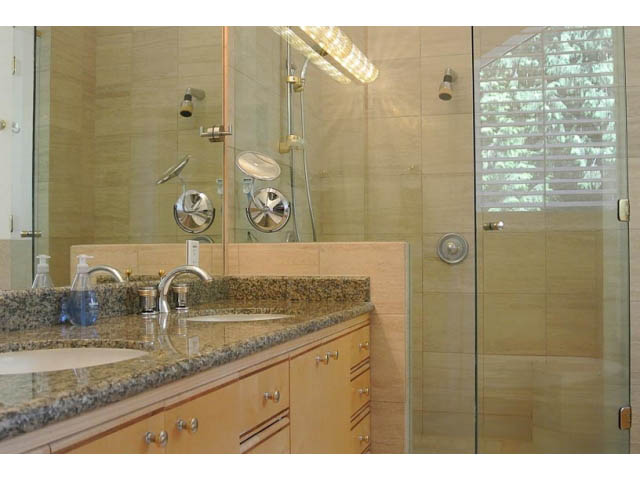 Spacious bathroom with granite countertops and a walk-in shower. - 2450 Riverside Drive, North Vancouver