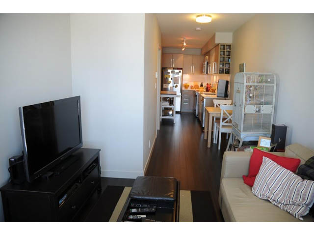 Bright kitchen with stainless steel appliances and hardwood floors. - 306-215 East 33rd Ave, Vancouver East Side