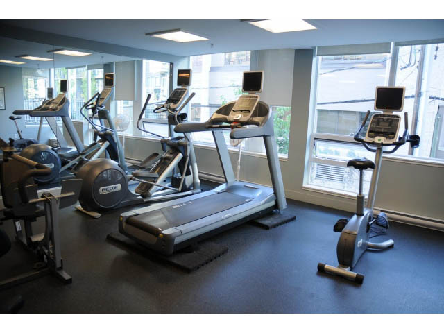 Bright gym with cardio machines and large windows. - 508 - 1675 West 8th Ave, Vancouver West Side