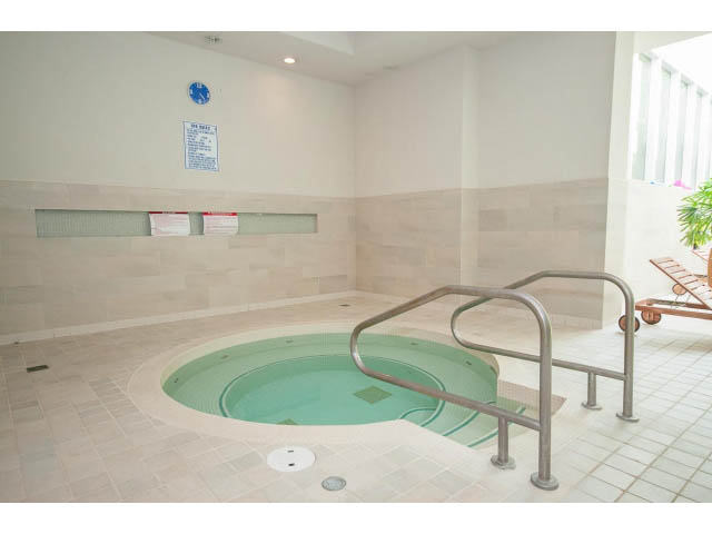 Spacious indoor hot tub with tiled walls and floor, modern design. - 106 - 633 Kinghorne Mews, Vancouver Downtown