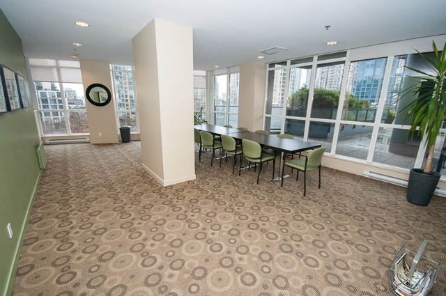 Spacious living room with large windows, city view, and modern furniture. - 2504 - 1199 Seymour Street, Vancouver Downtown