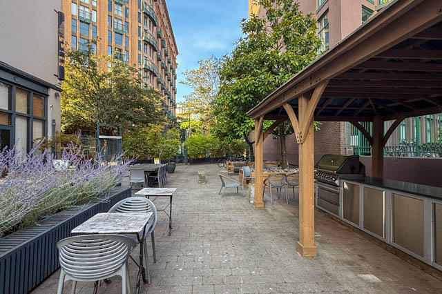 Spacious patio with outdoor seating, lavender plants, and a covered grill area. - 221 - 55 E. Cordova, Vancouver Downtown