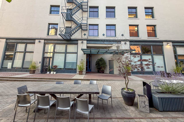 Furnished patio with outdoor seating and potted plants, perfect for downtown living. - 221 - 55 E. Cordova, Vancouver Downtown