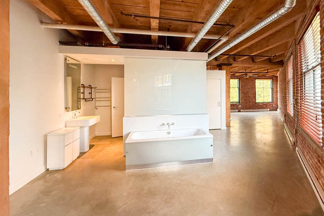 Modern loft with exposed brick, polished concrete floors, and a large bathtub. - 221 - 55 E. Cordova, Vancouver Downtown