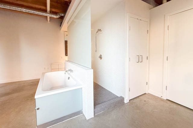 Modern bathroom with white subway tiles and a walk-in shower. - 221 - 55 E. Cordova, Vancouver Downtown